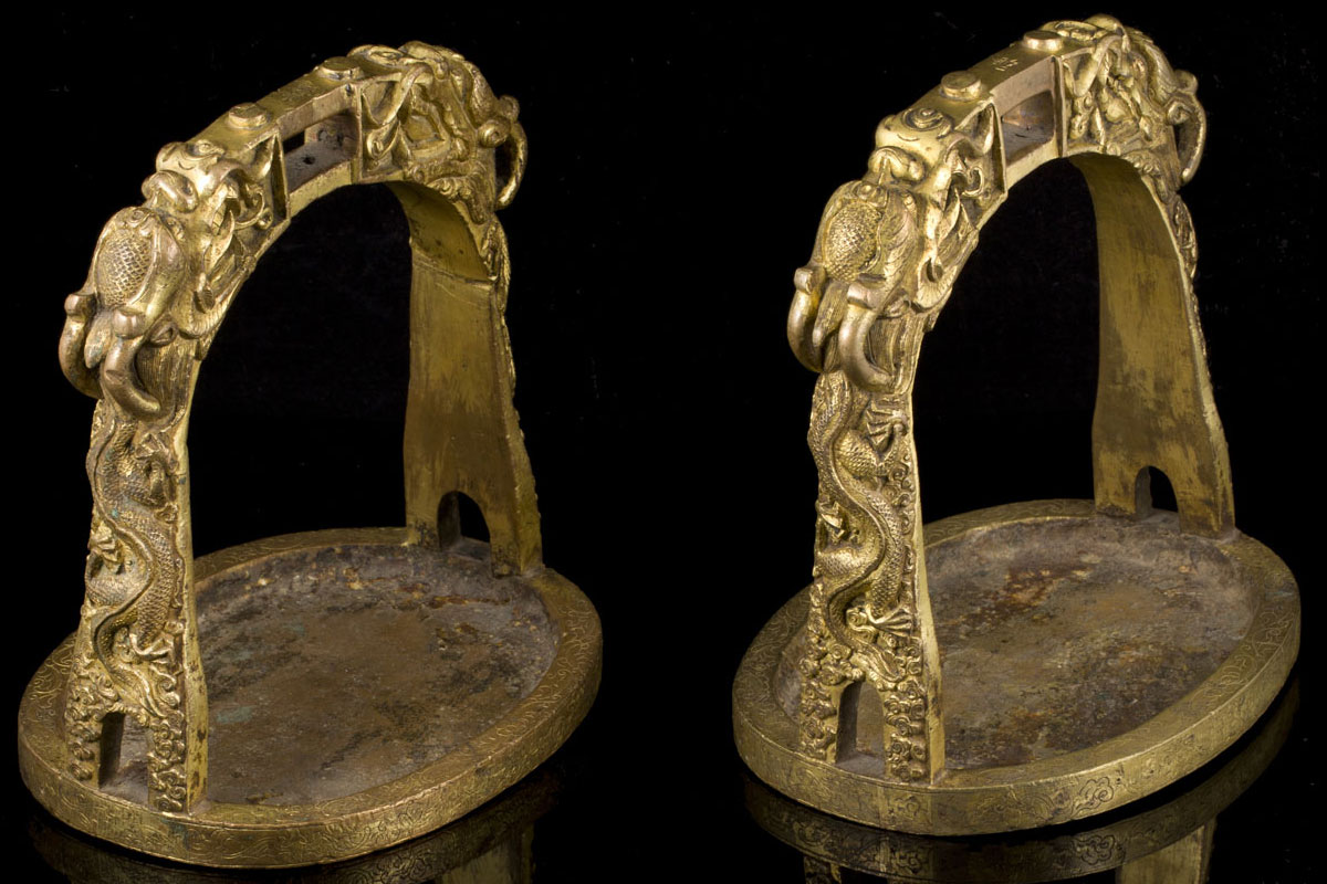 A rare pair of early Qing gilt bronze five clawed dragons stirrups