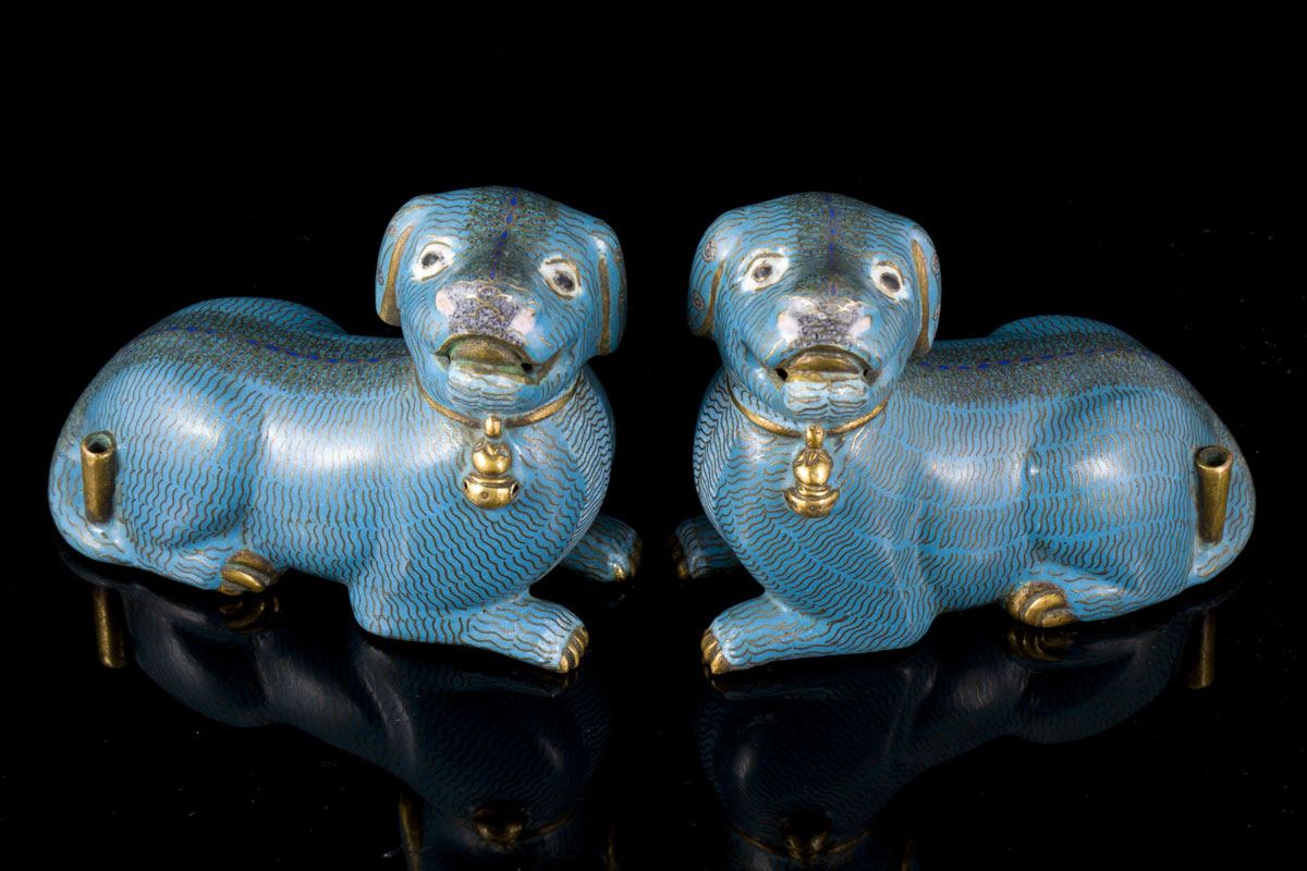 A rare Qianlong pair of gilt bronze and cloisonn&eacute; enamel dogs