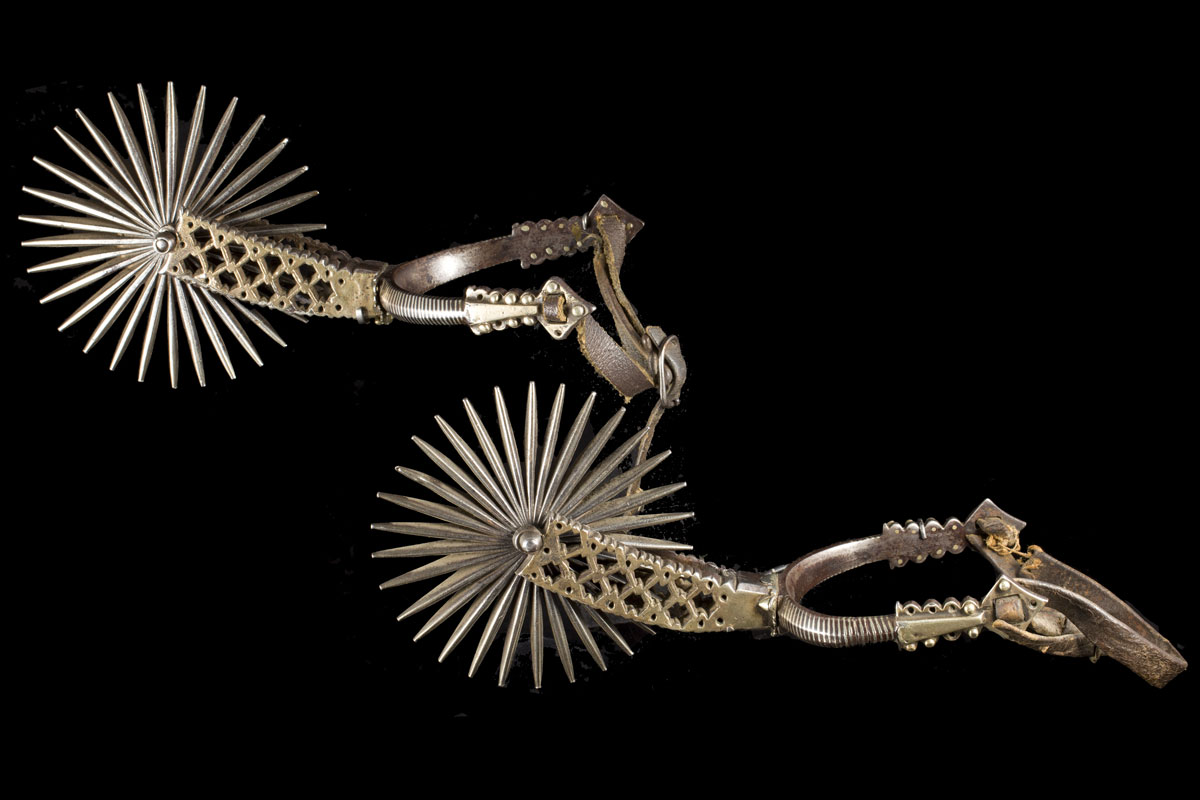 A pair of steel silver inlaid Argentinean spurs, 19th century